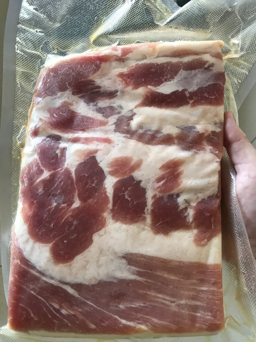 Allowing the bacon to cure in the bag