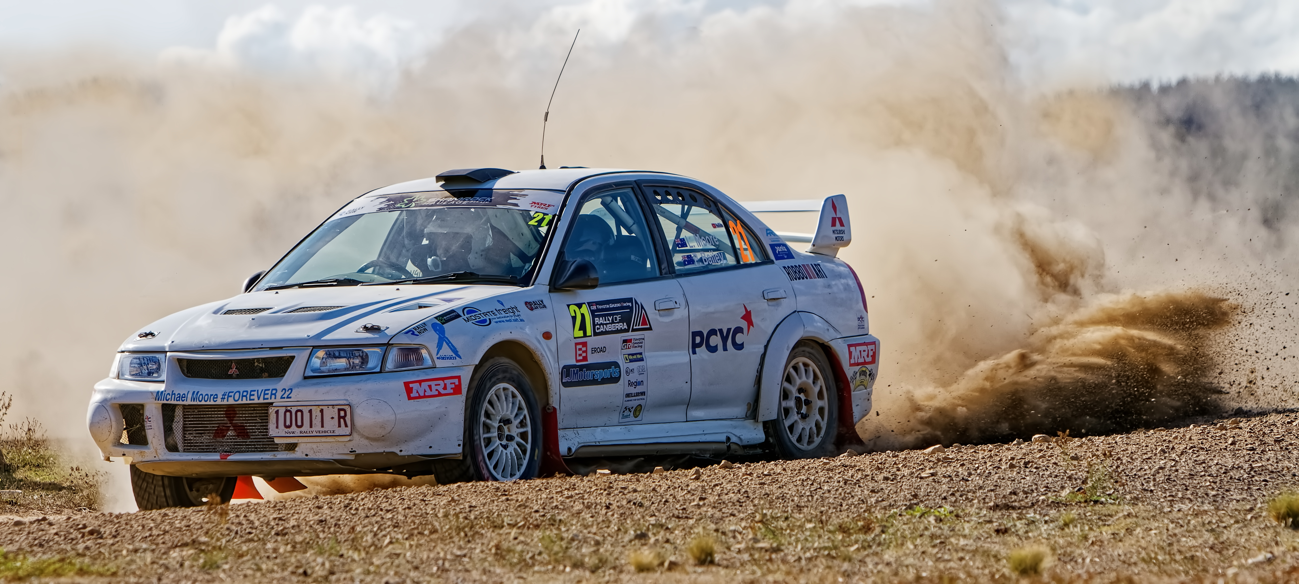 Rally car (Mitsubishi Lancer) kicking up a dust cloud