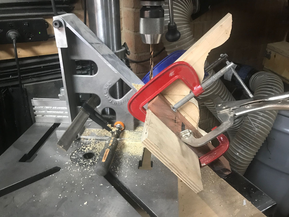 An improvised jig for drilling holes at 45 degrees.